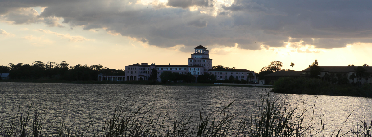 A body of water with buildings in the background.