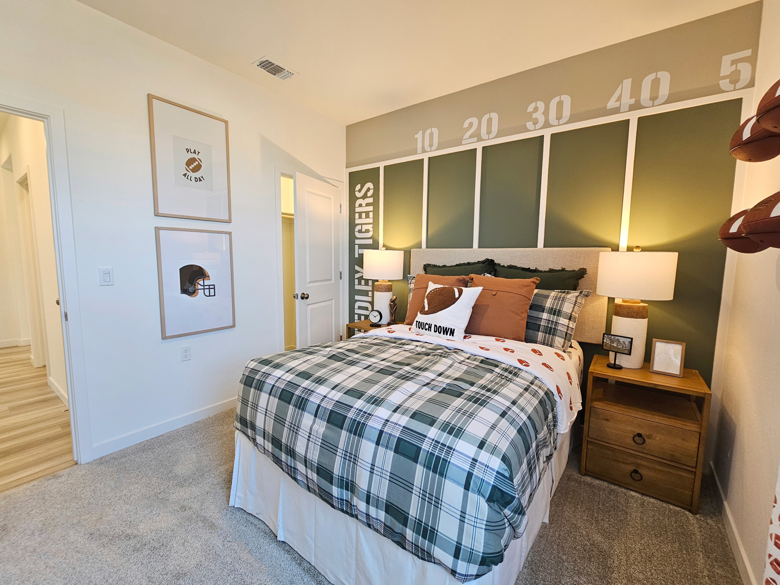 A bedroom with a bed and a dresser.