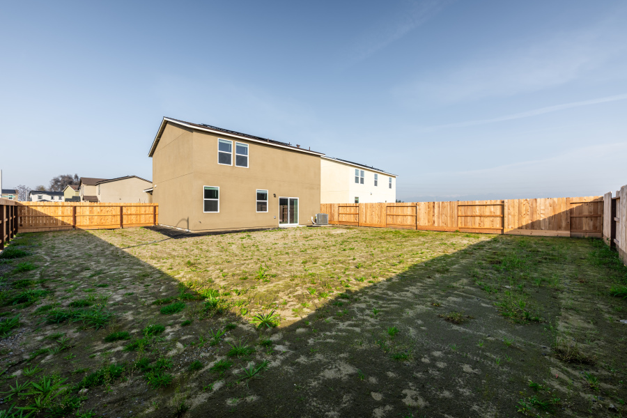 A house with a fence around it.