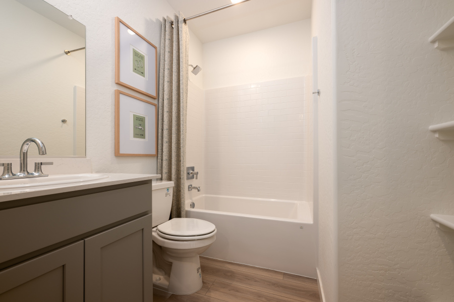 A bathroom with a toilet and sink.