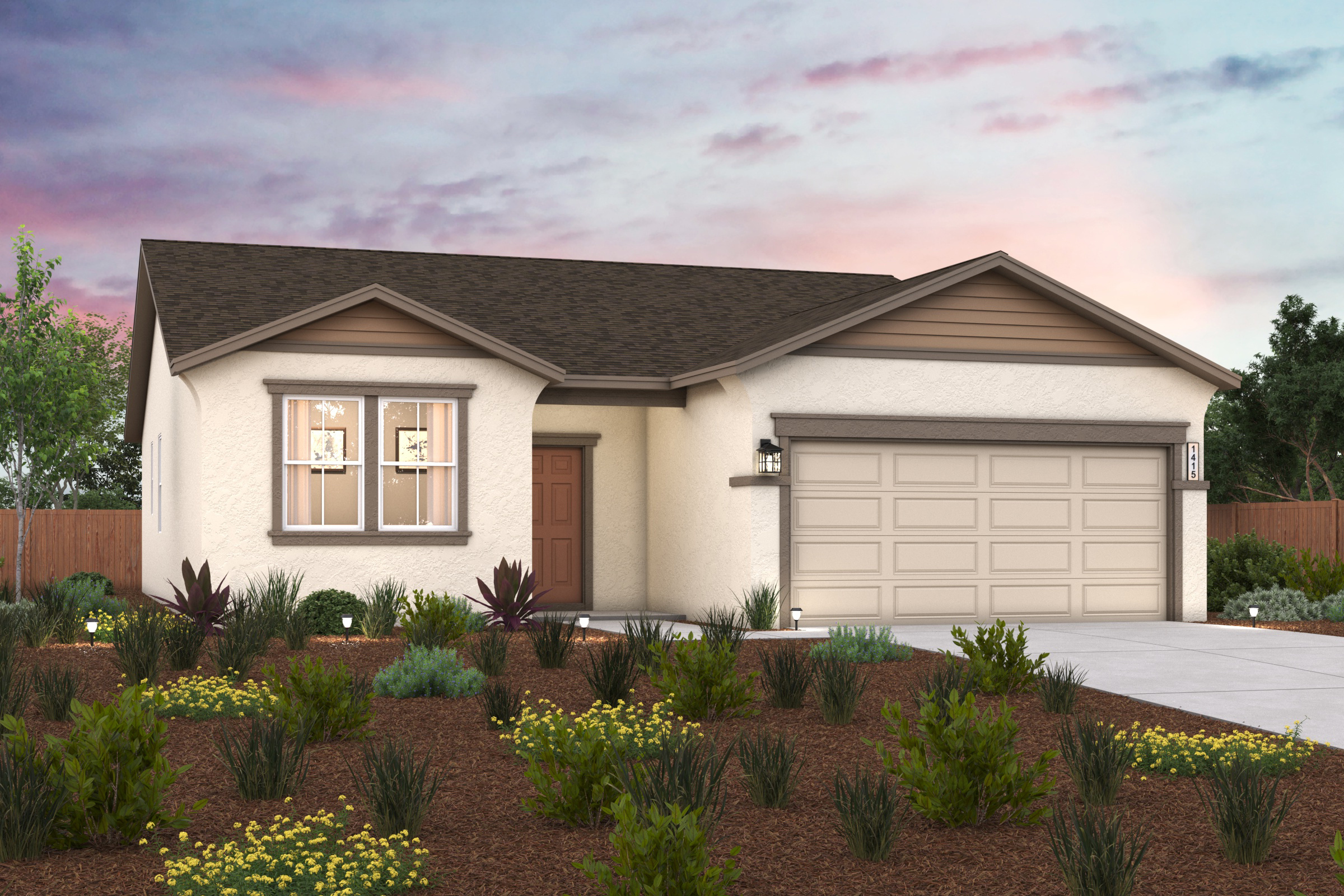 A house with a garage and a garden in front of it.