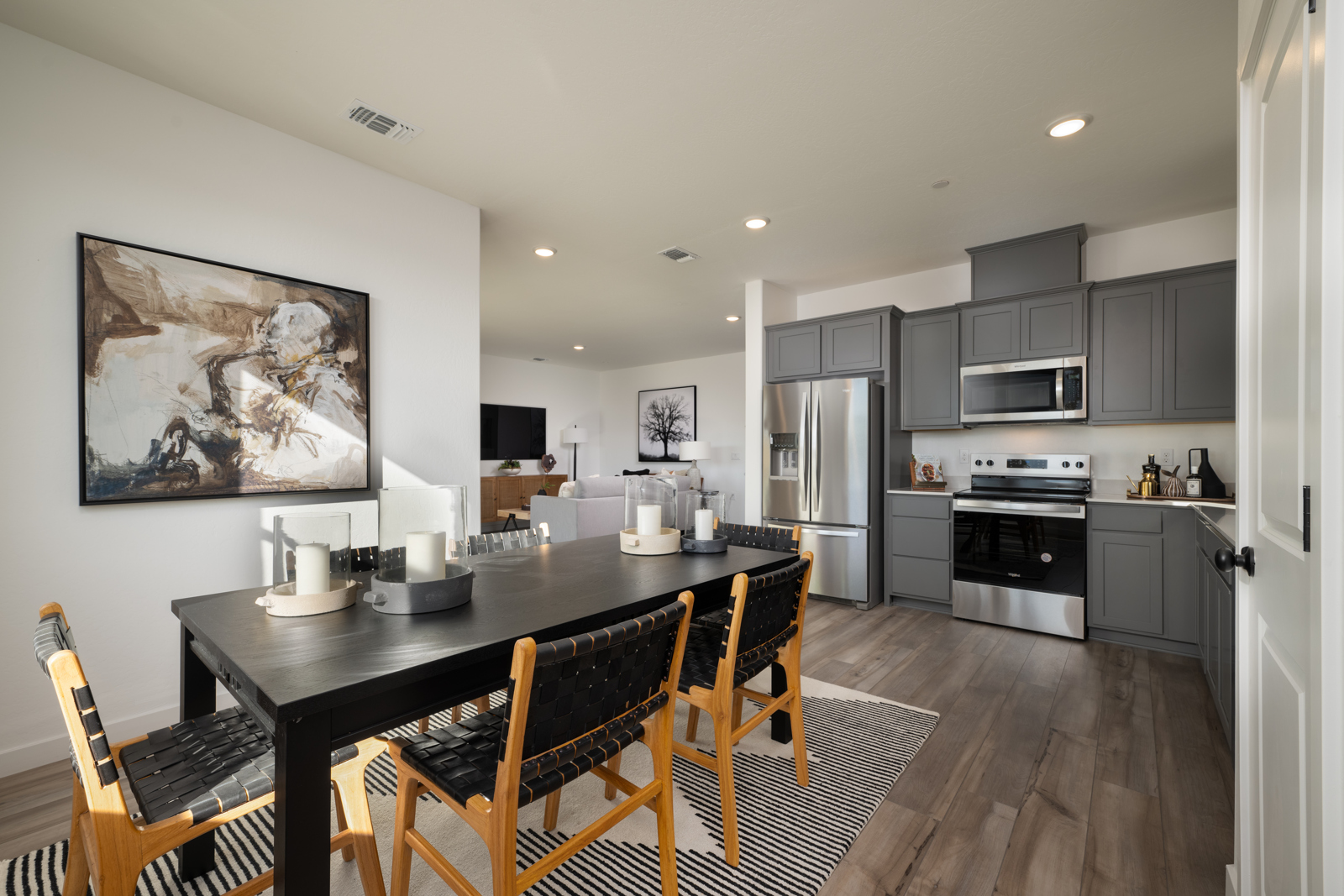 A kitchen with a dining table.