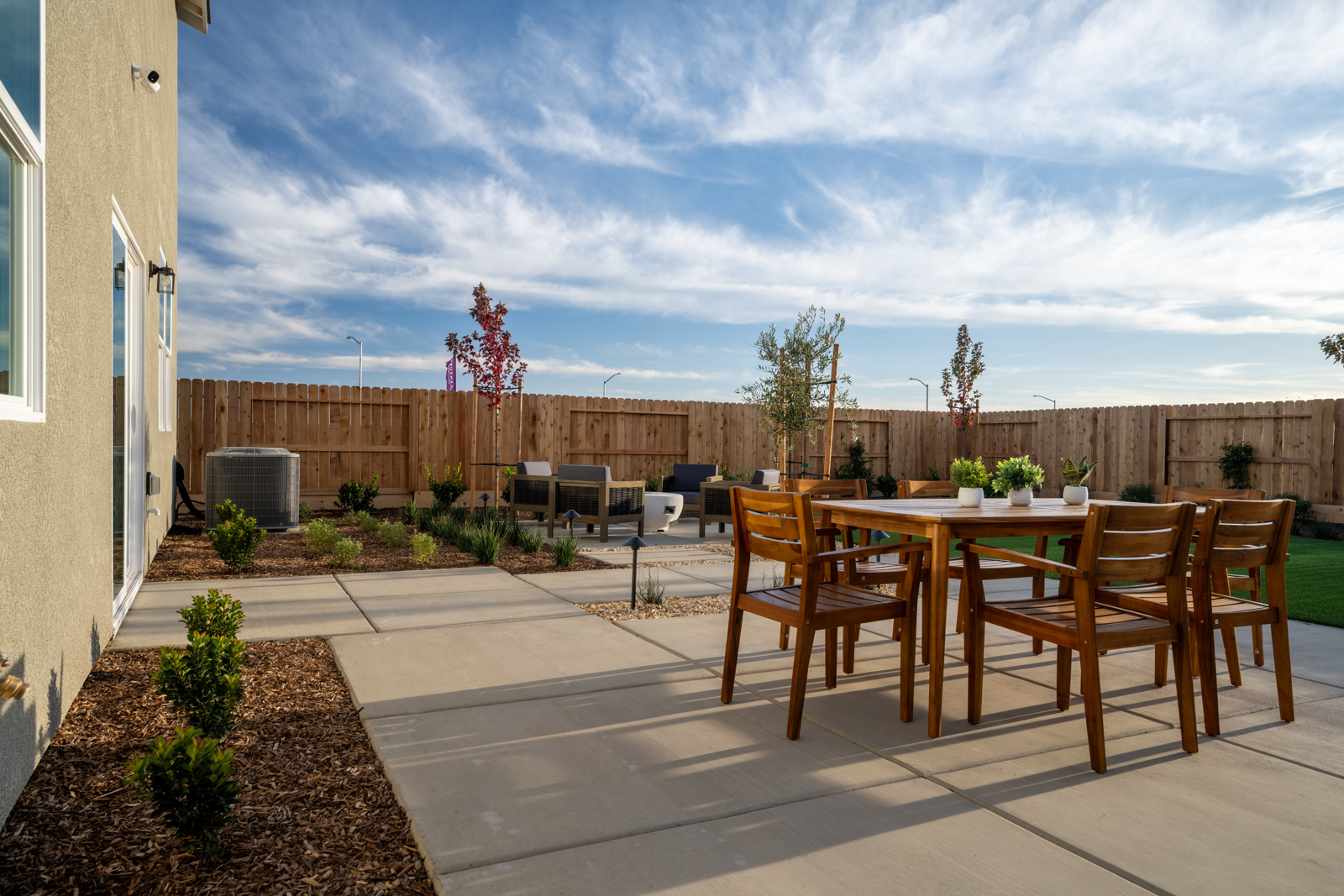 A table and chairs on a deck.
