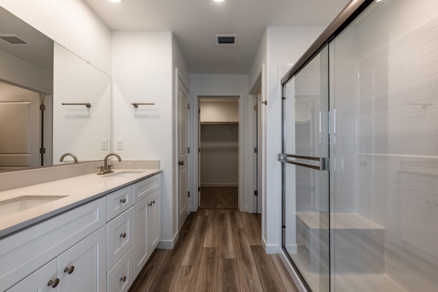 A bathroom with a glass shower.