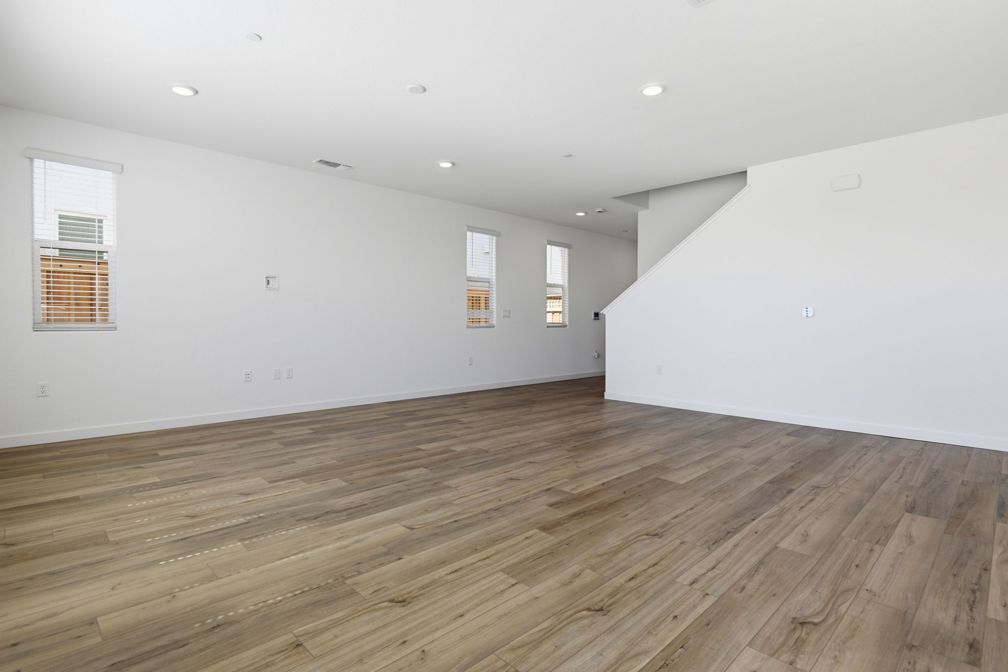 A room with a wood floor and a wood floor.