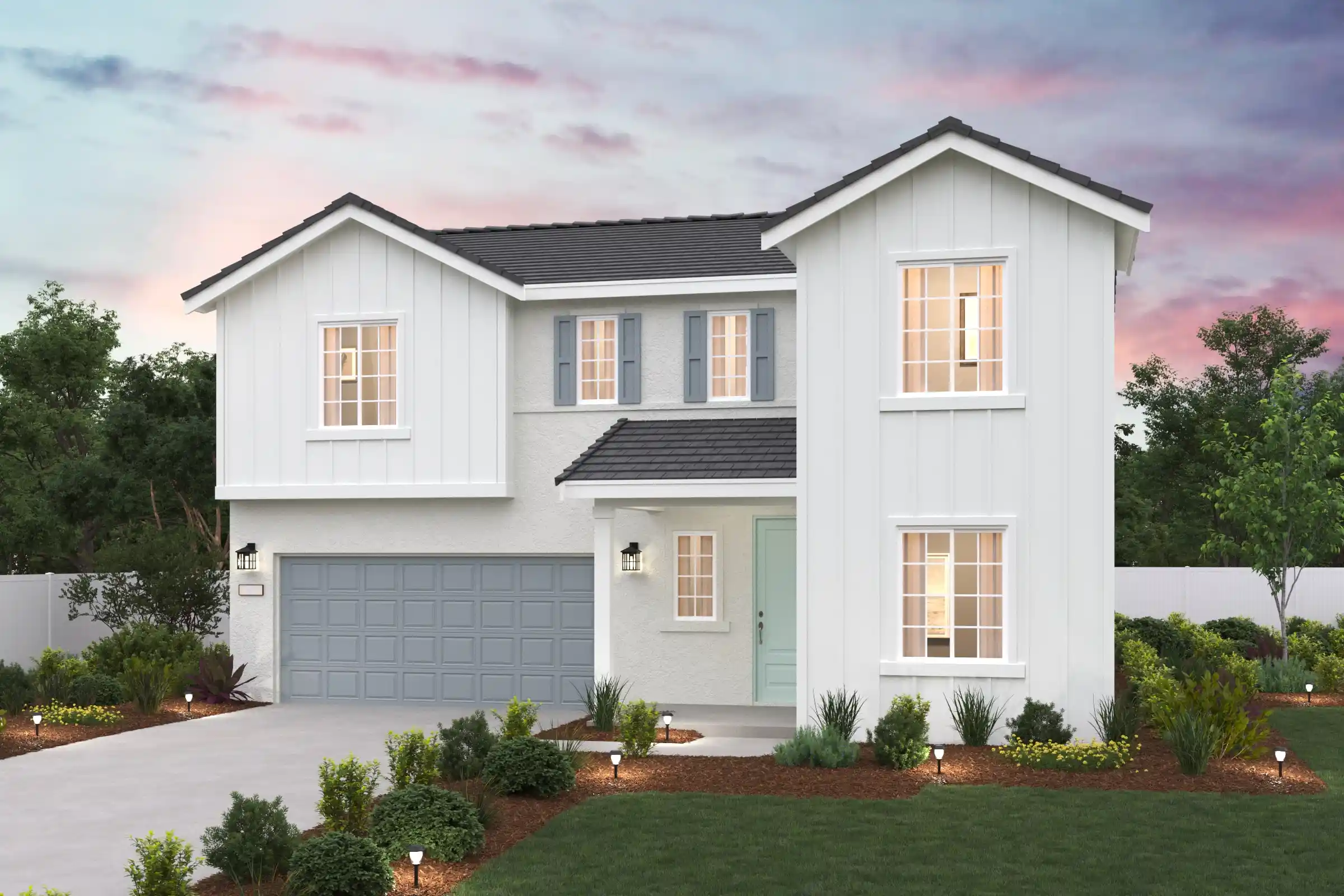 A white house with a garage.