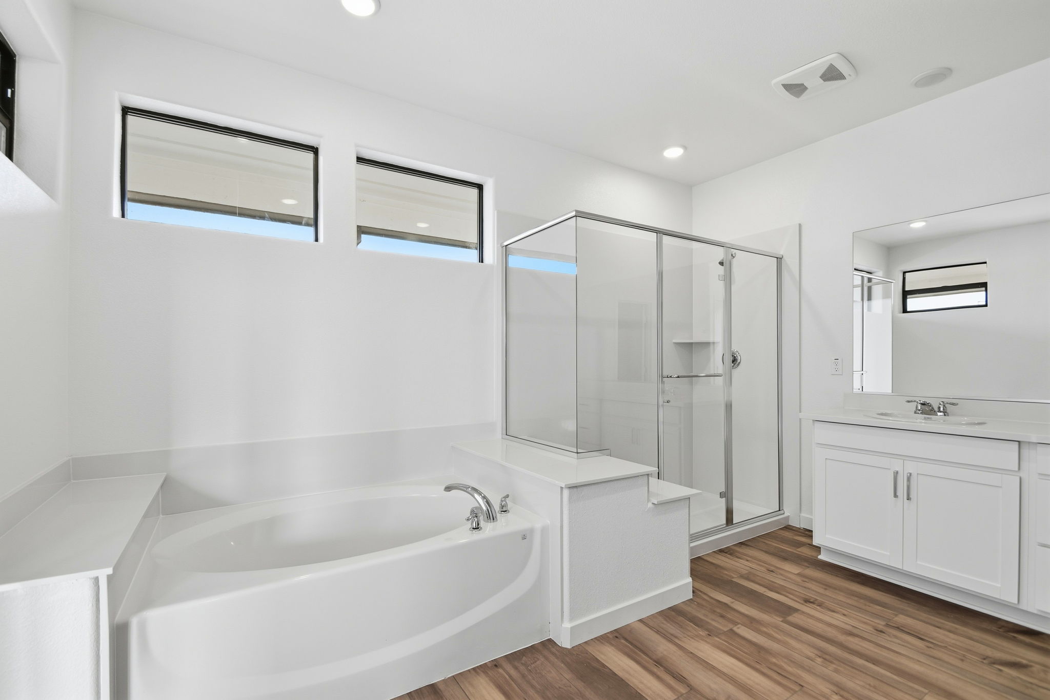 A bathroom with a glass shower.