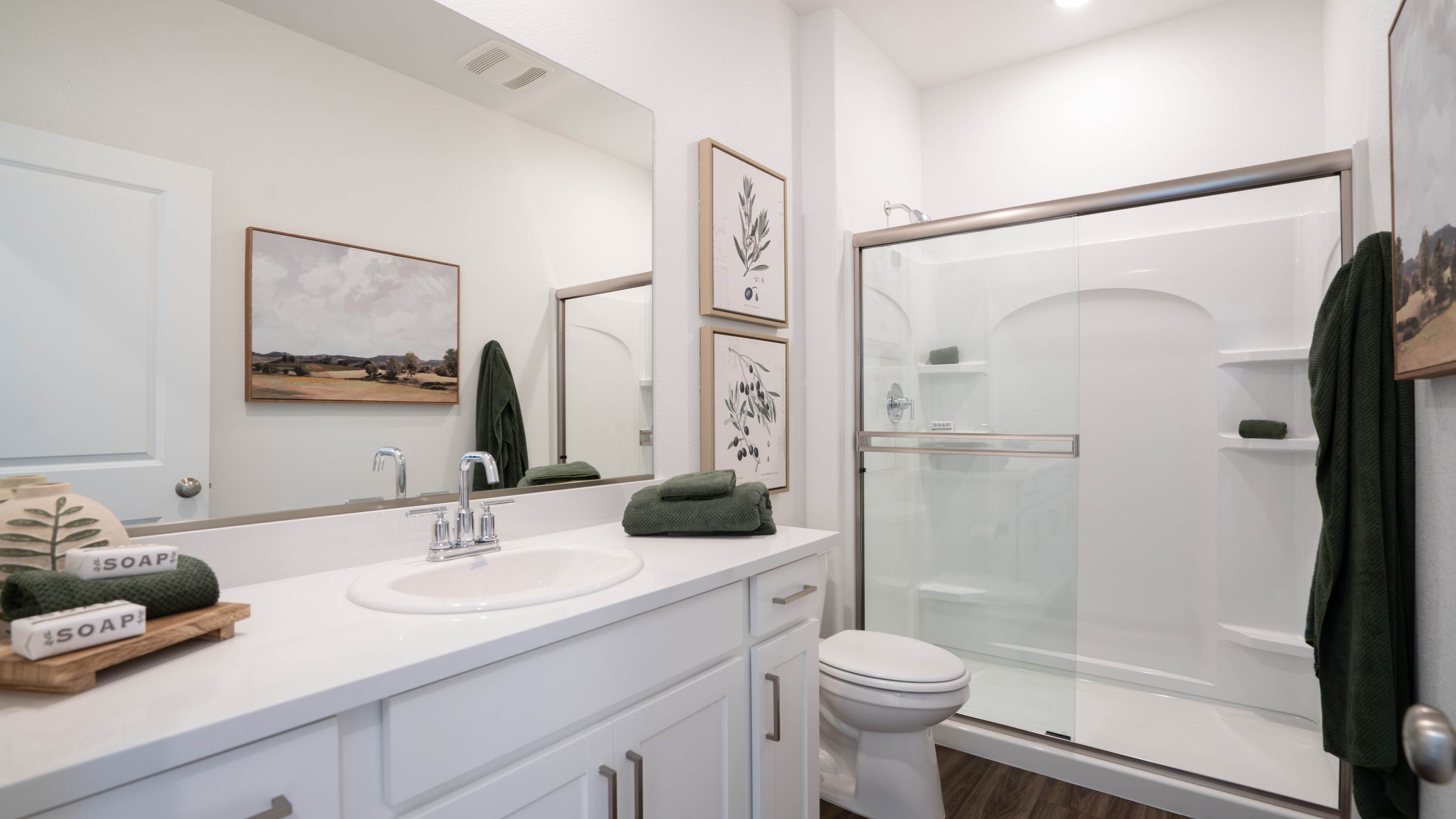 A bathroom with a glass shower.