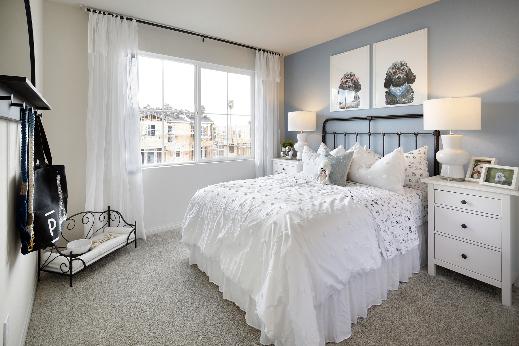 A bedroom with a bed and a window.