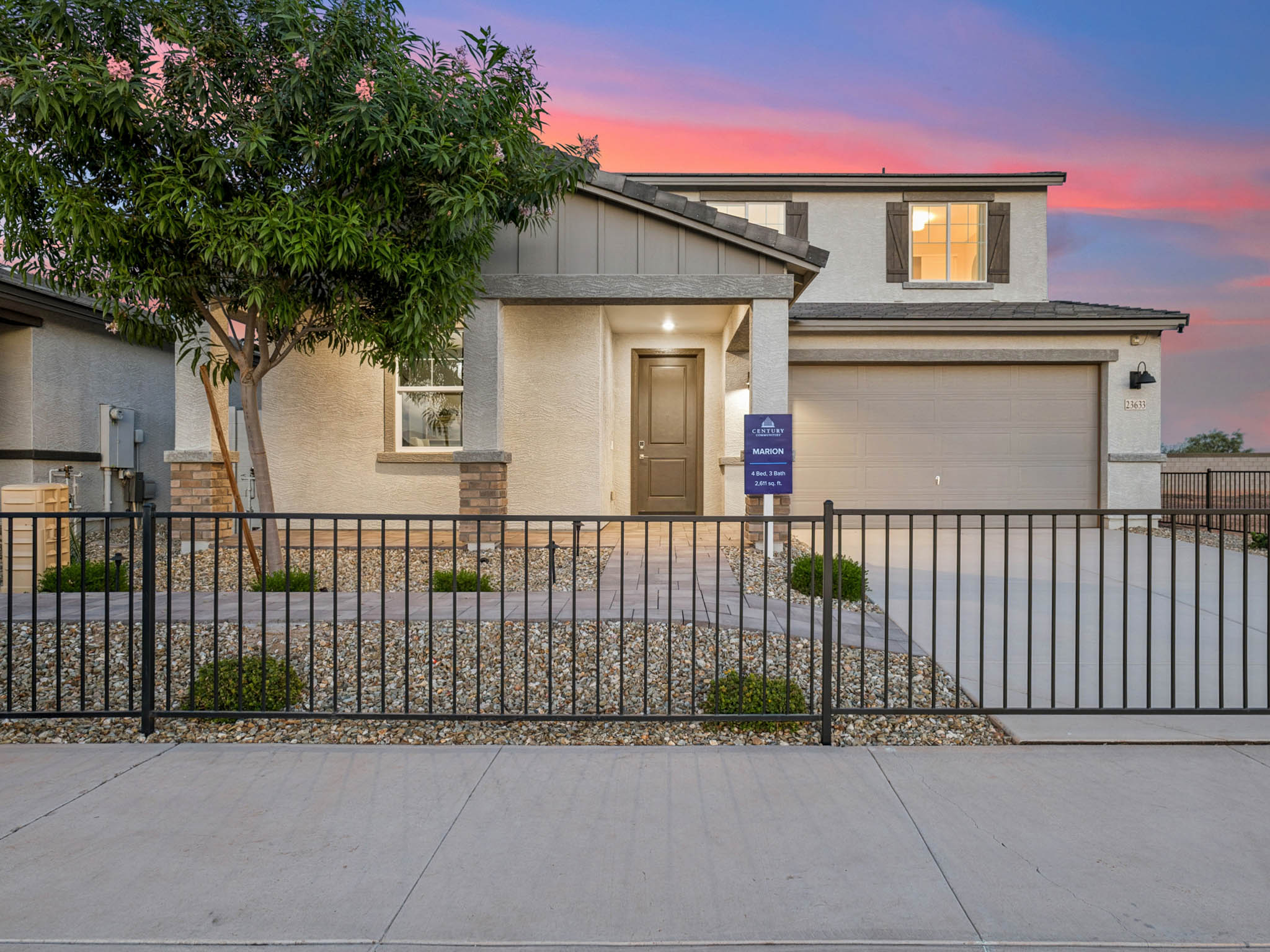 A house with a fence and trees.