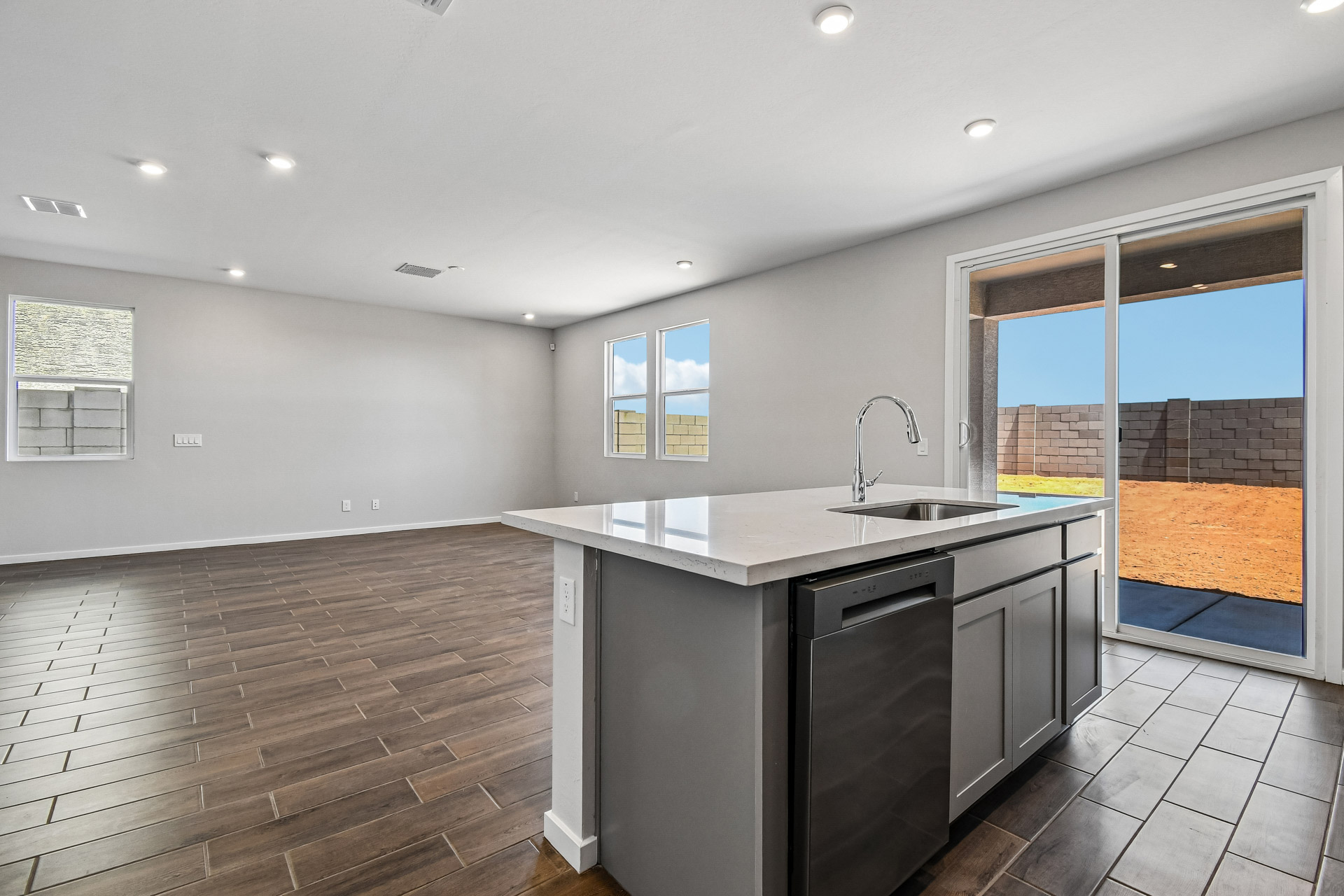 A kitchen with a large glass door.