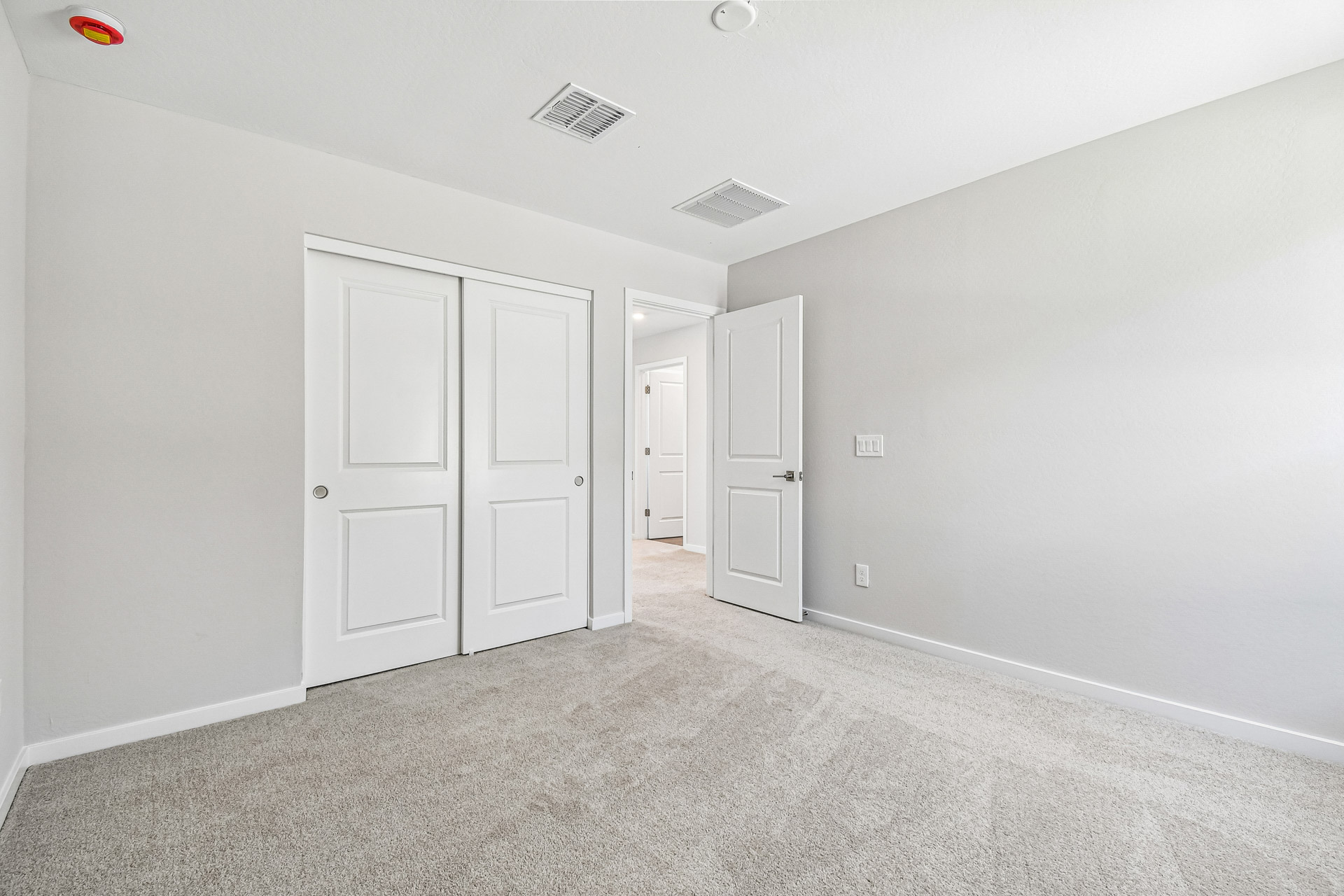 A room with white doors.