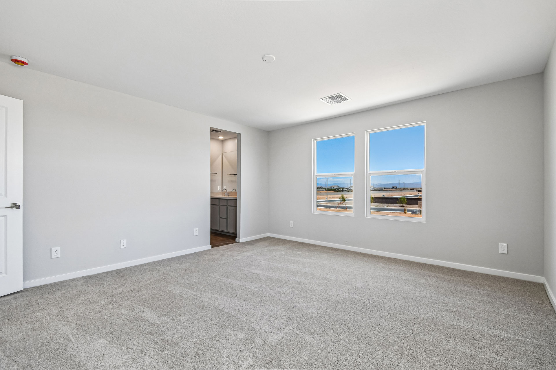 A room with a window and a door.