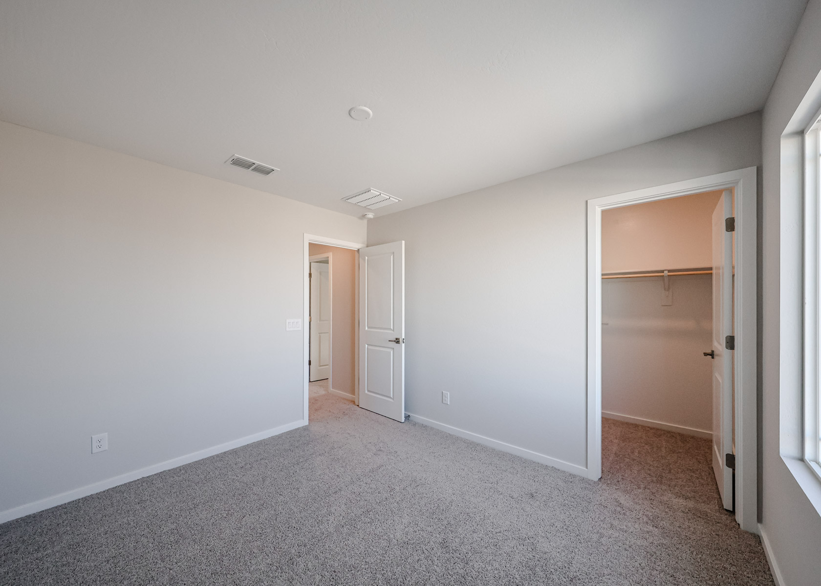 A hallway with white walls.