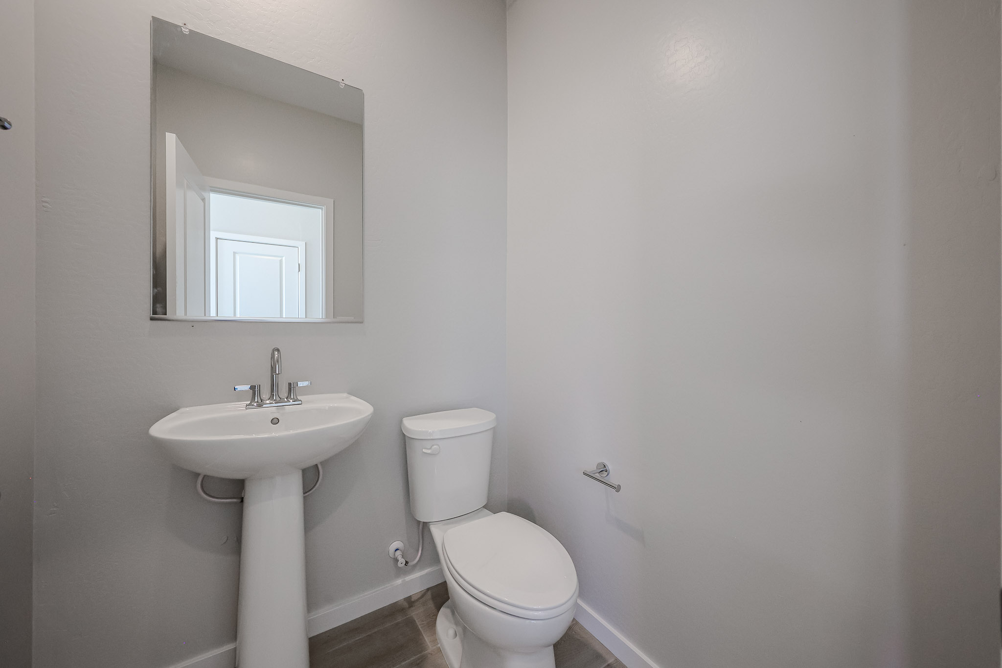 A bathroom with a sink and toilet.