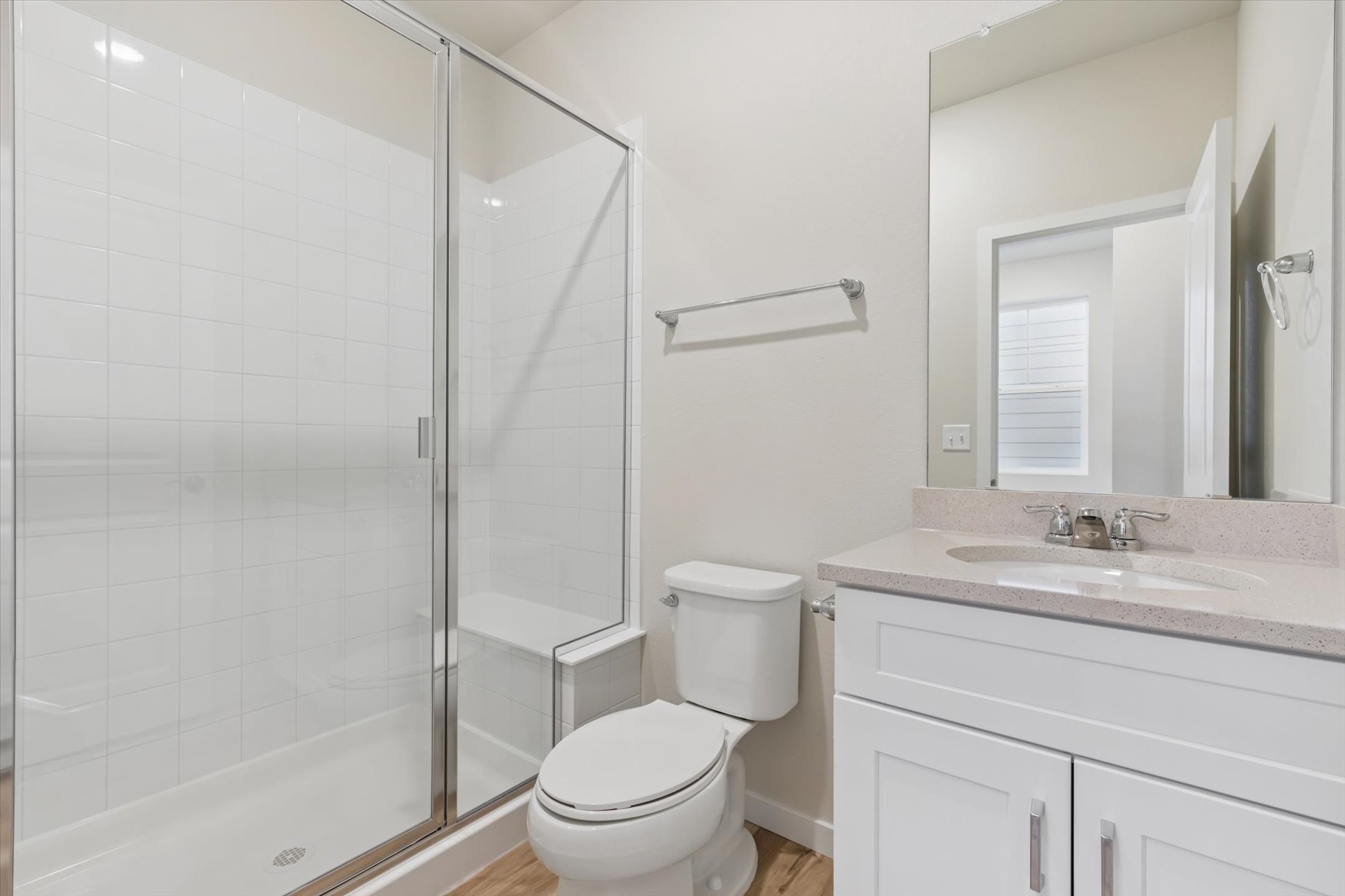A bathroom with a glass shower.