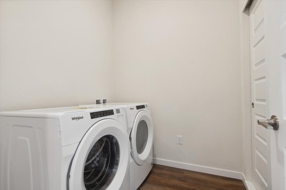 A white washing machine in a room.