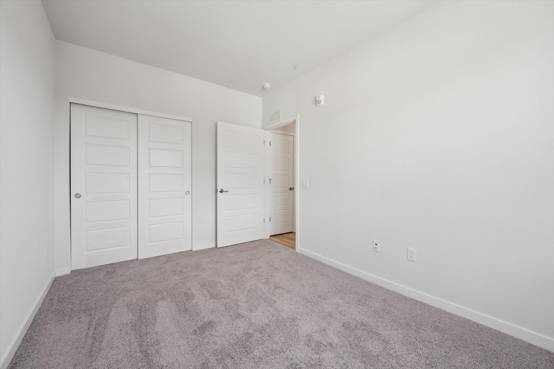 A room with white doors.