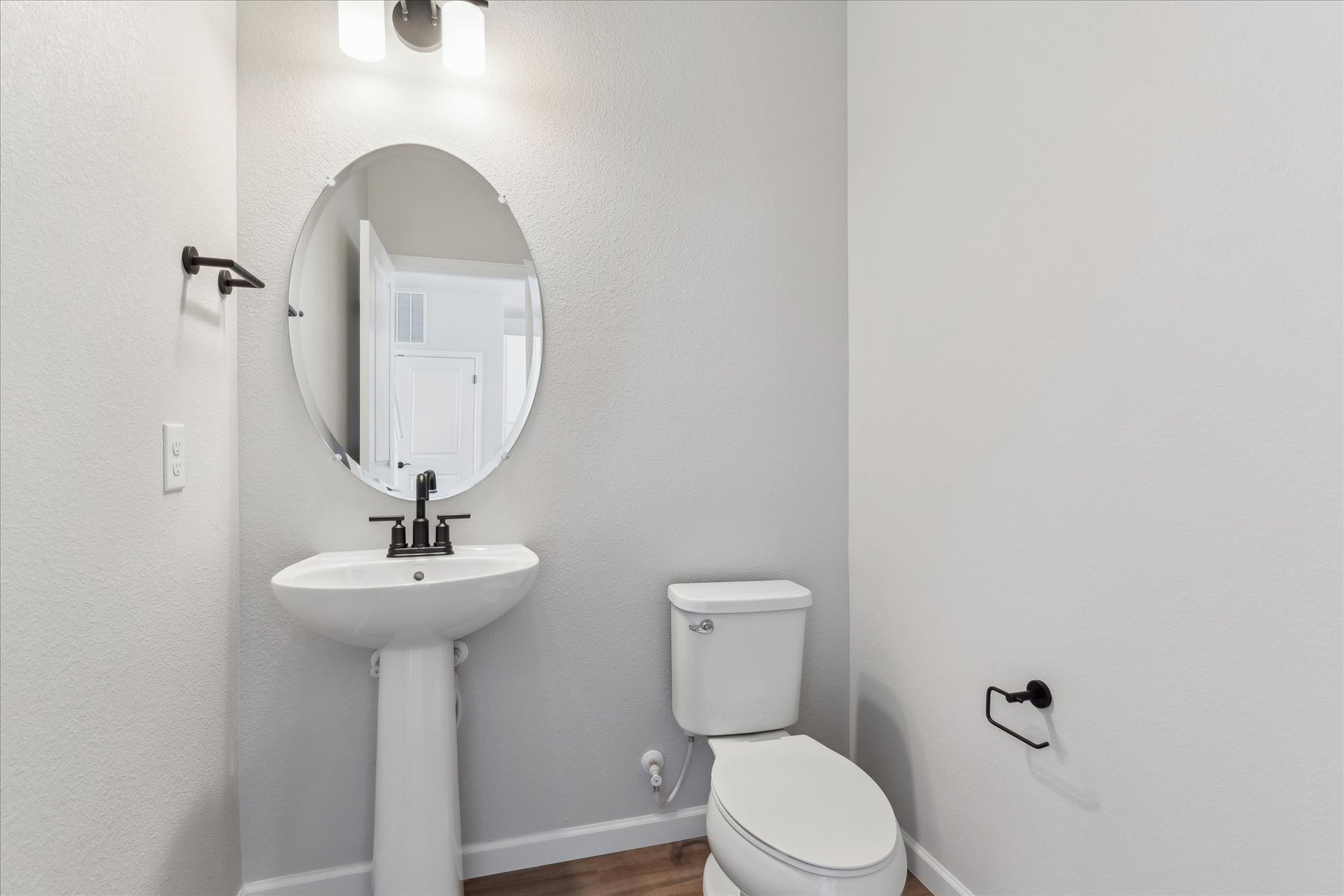 A bathroom with a sink and toilet.