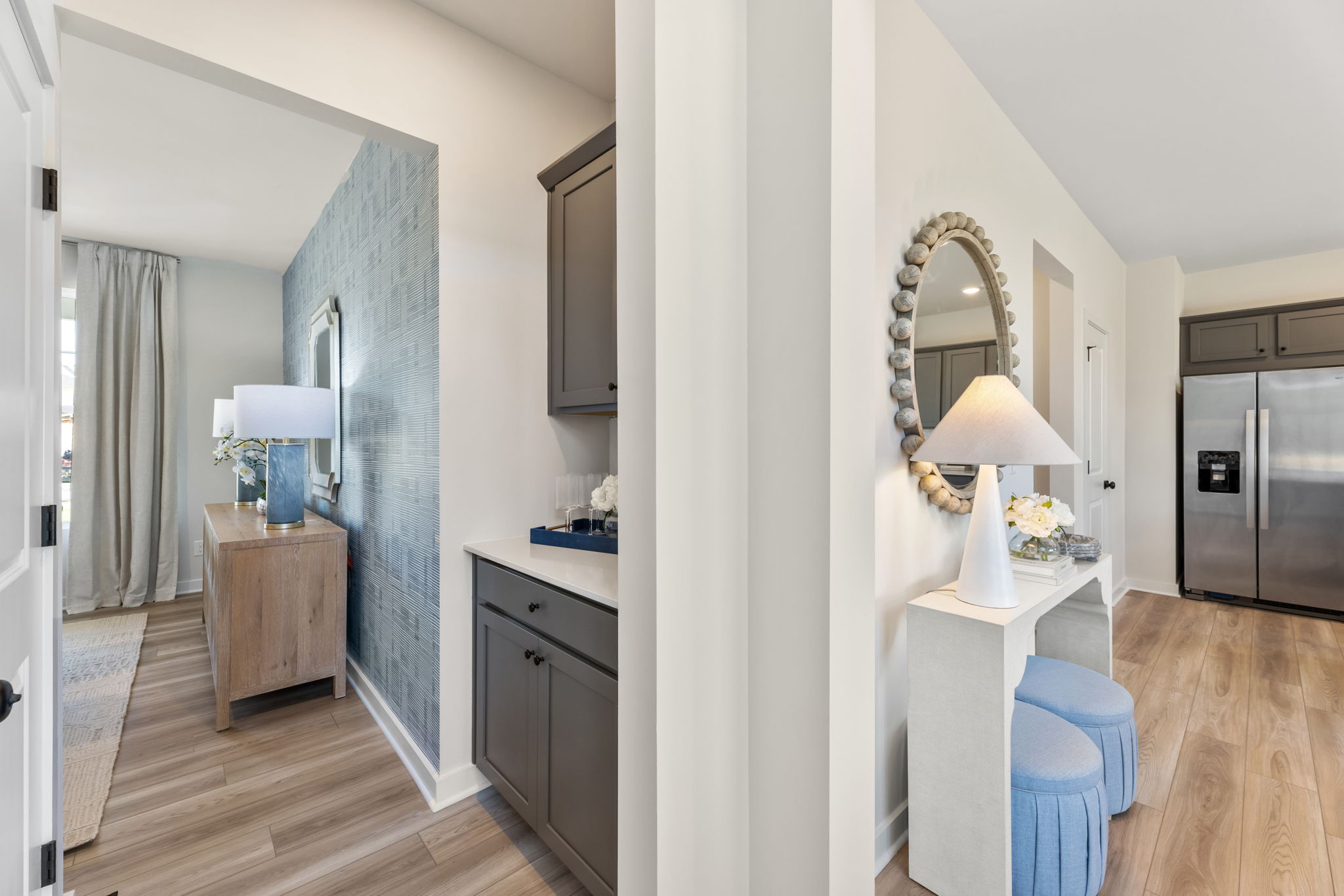 A room with a mirror and a table.