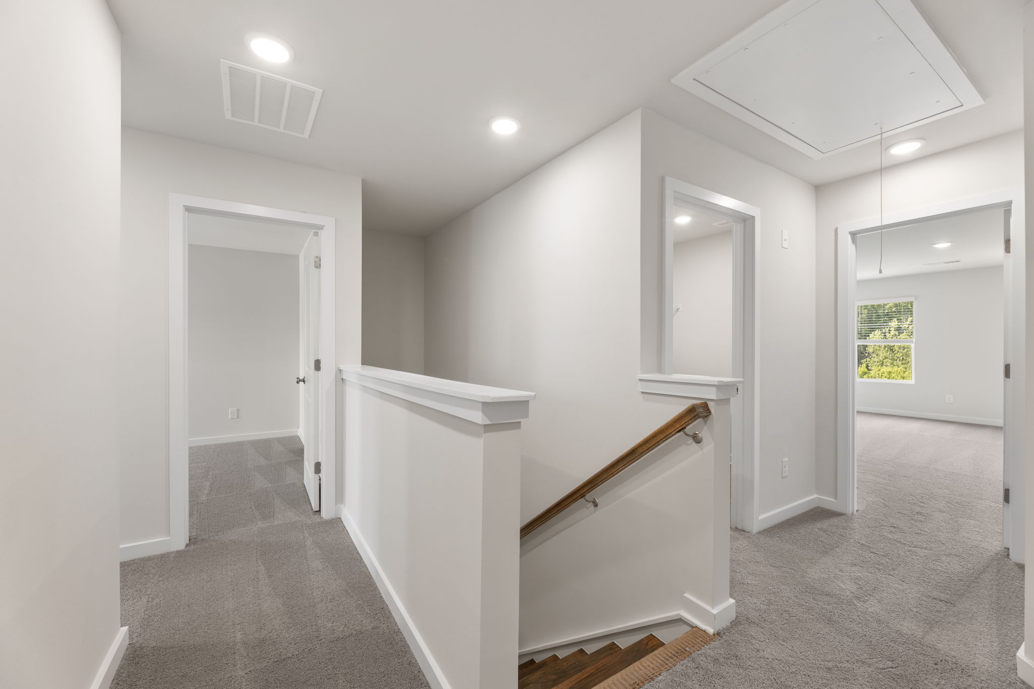 A bathroom with white walls.
