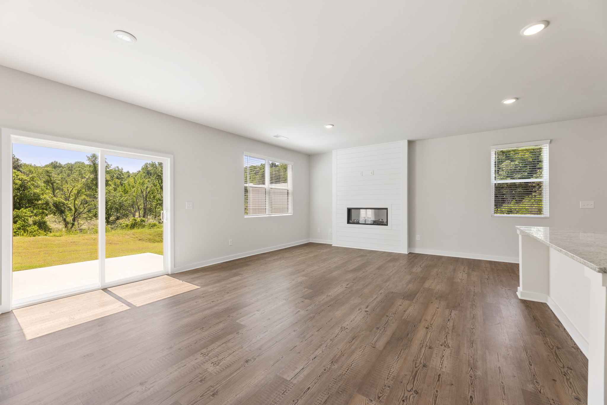 A large room with a wood floor.