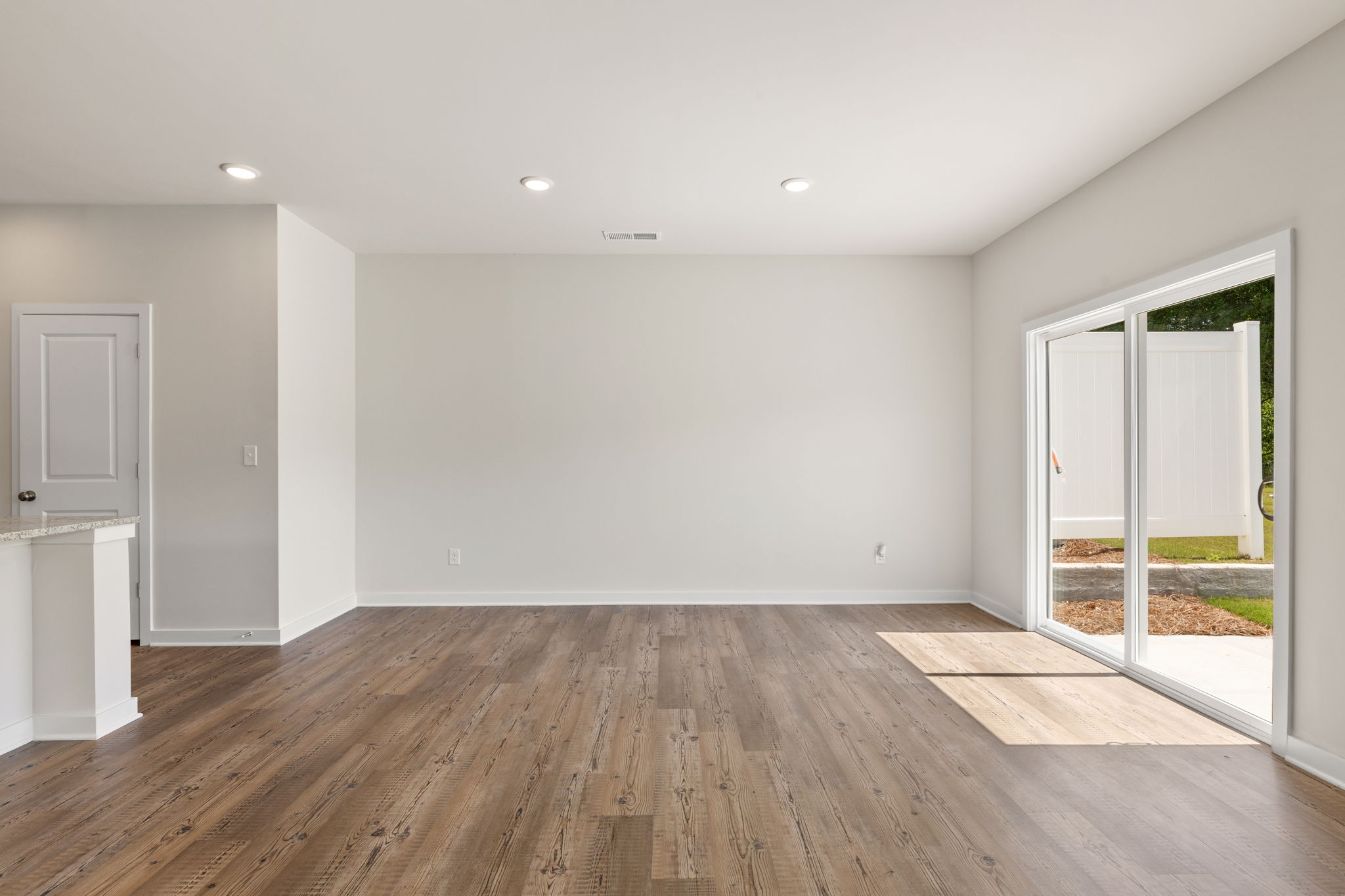 A room with a wood floor and a wood floor.