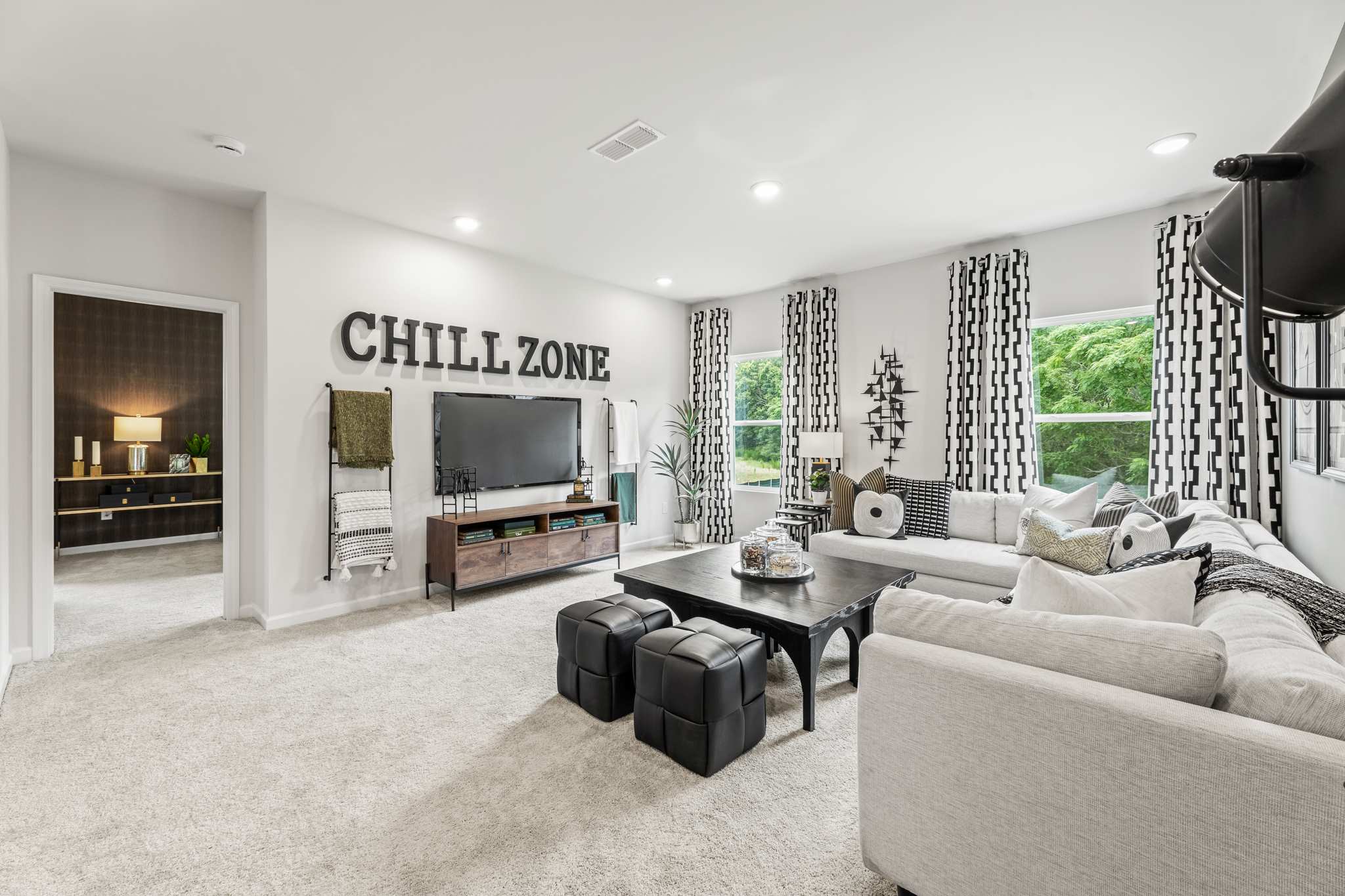 A living room with a tv and couches.
