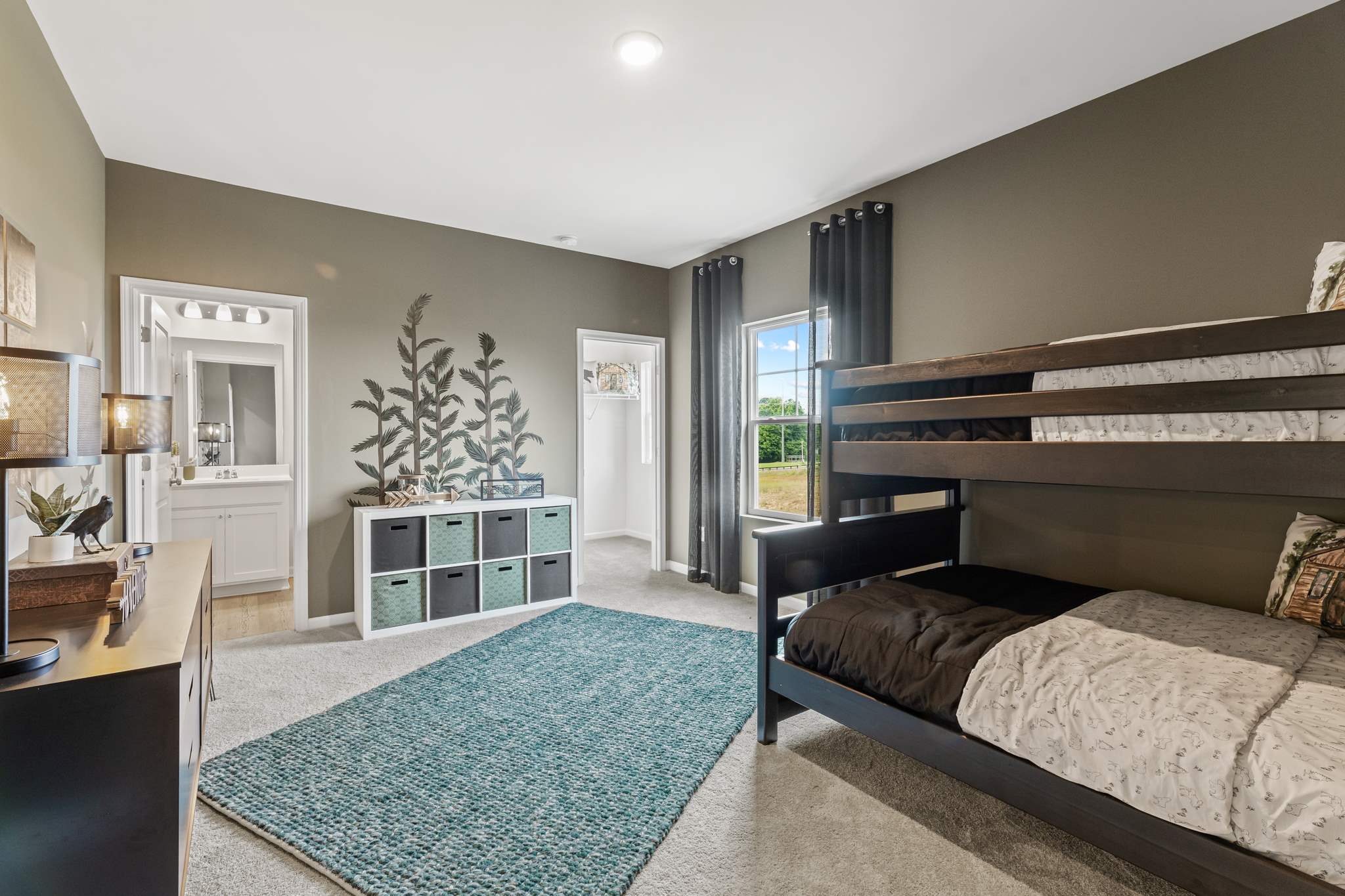 A bedroom with a bed and a couch.