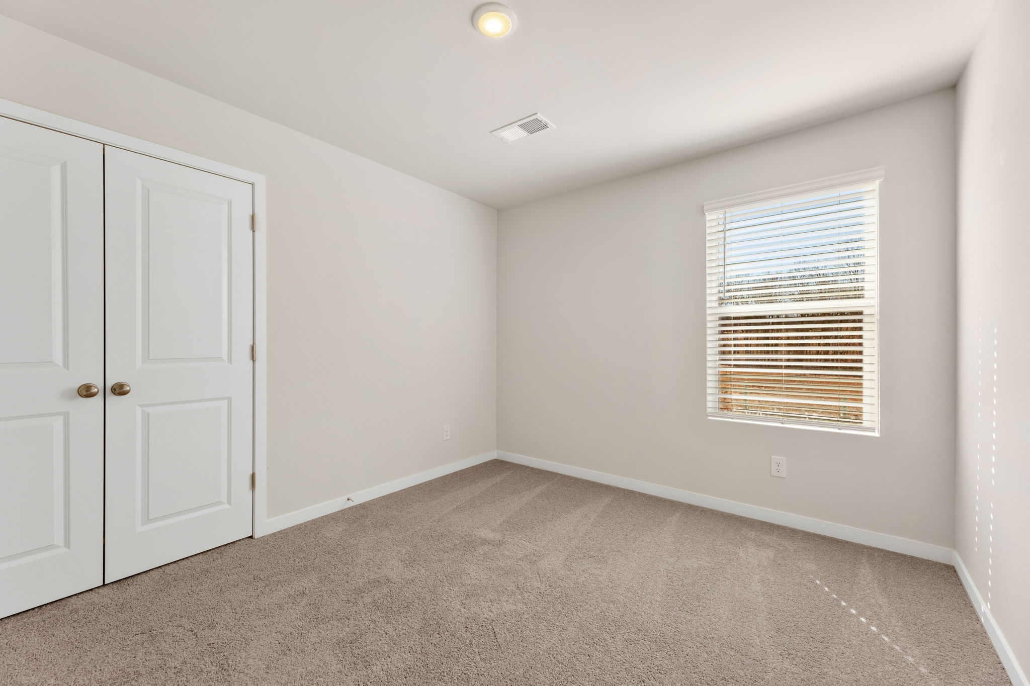 A room with white doors.