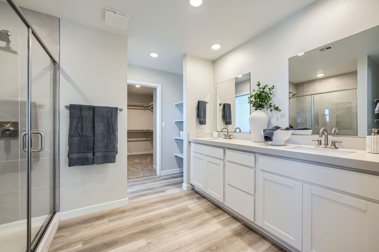 A bathroom with a glass shower.