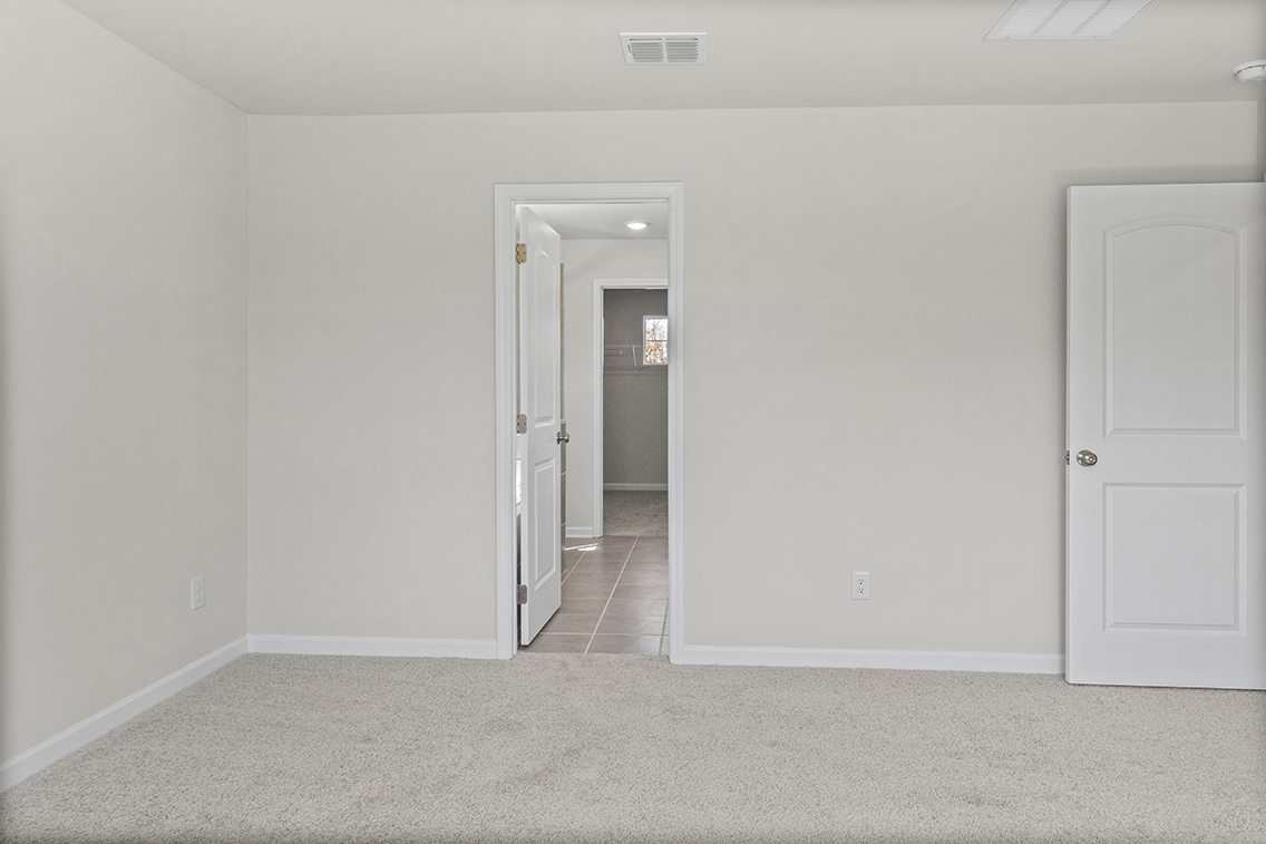 A hallway with white doors.