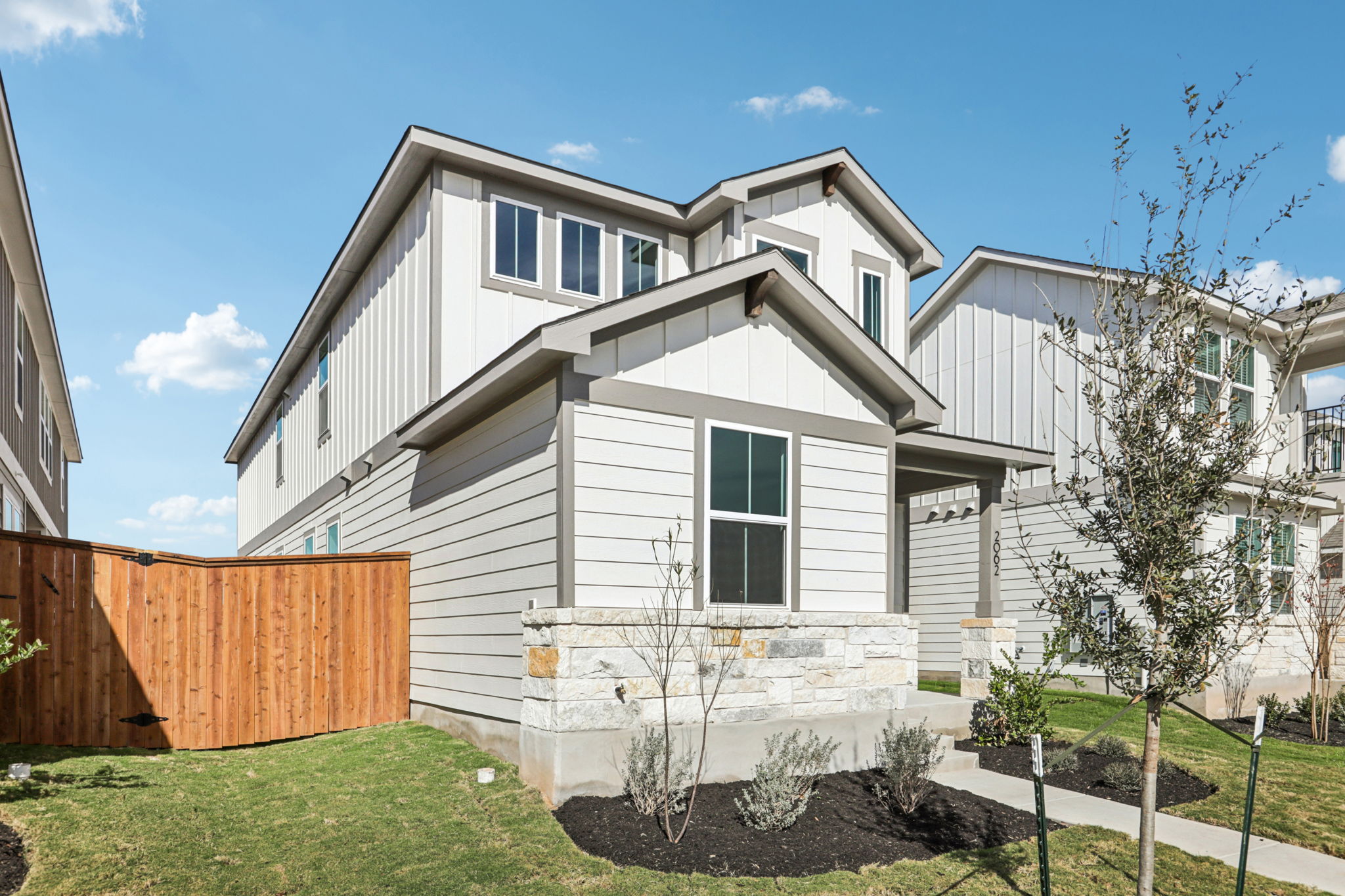 A white house with a fence.