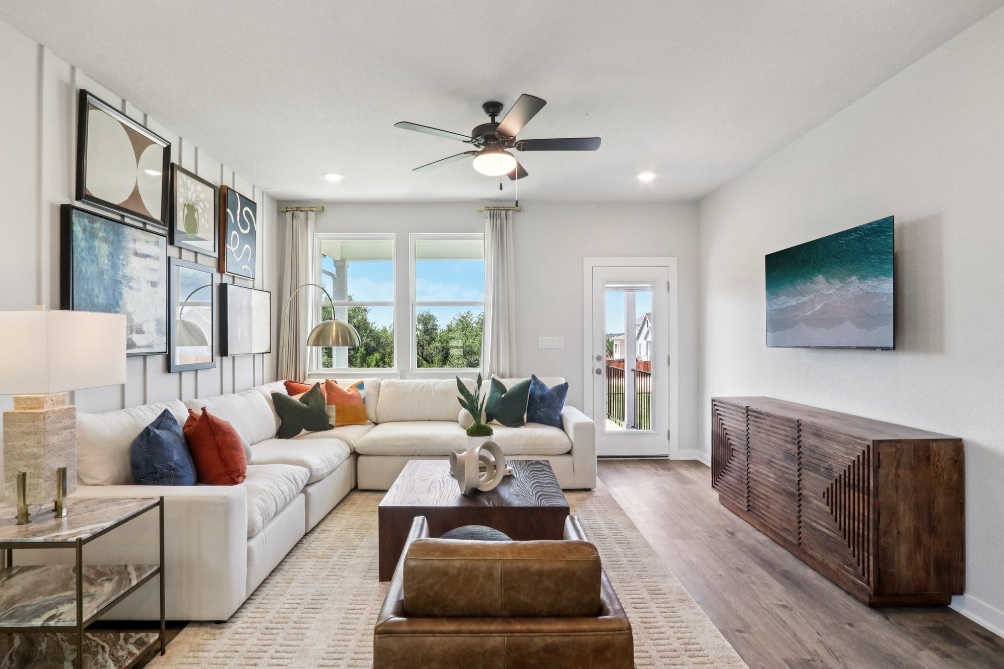 A living room with a wood floor.