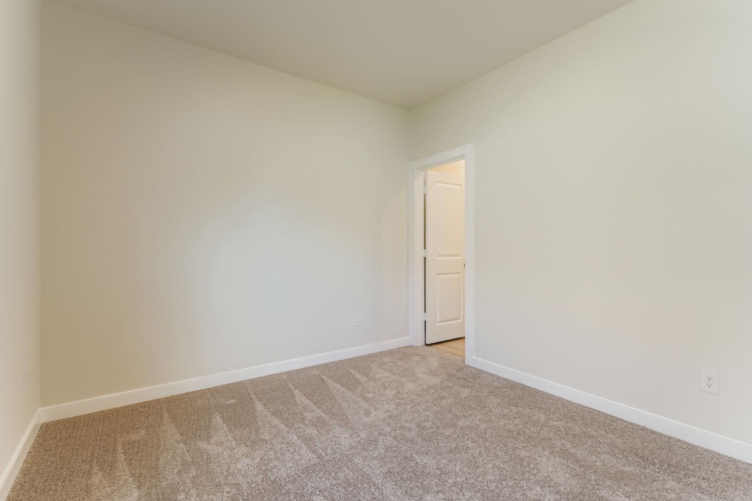 A hallway with a door.