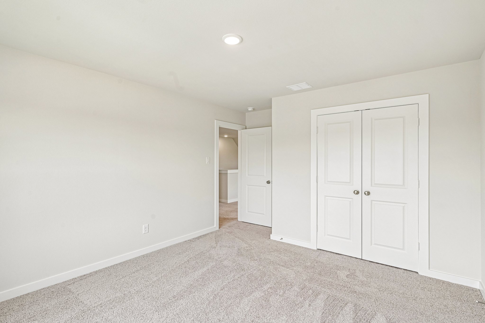 A room with white doors.