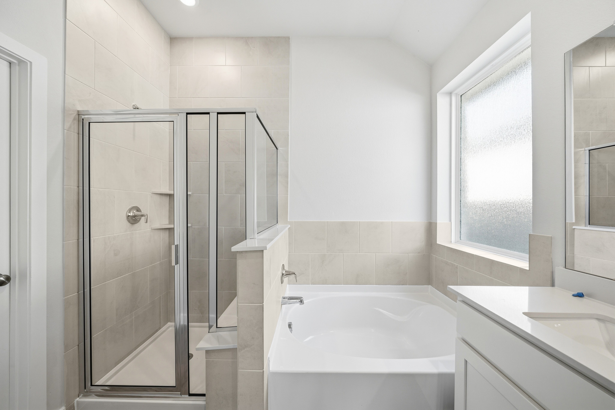 A bathroom with a glass shower.