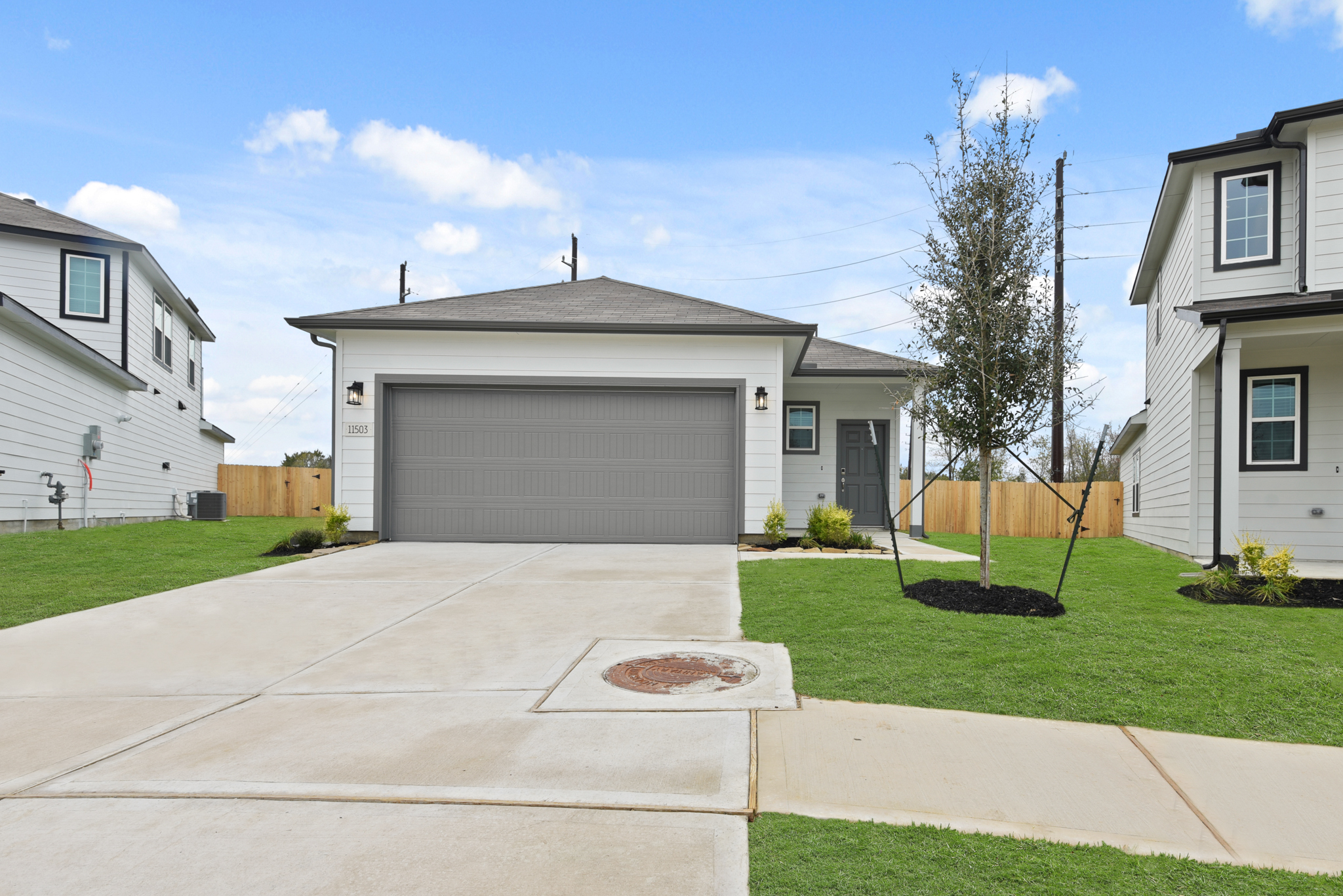 A driveway leading to a house.