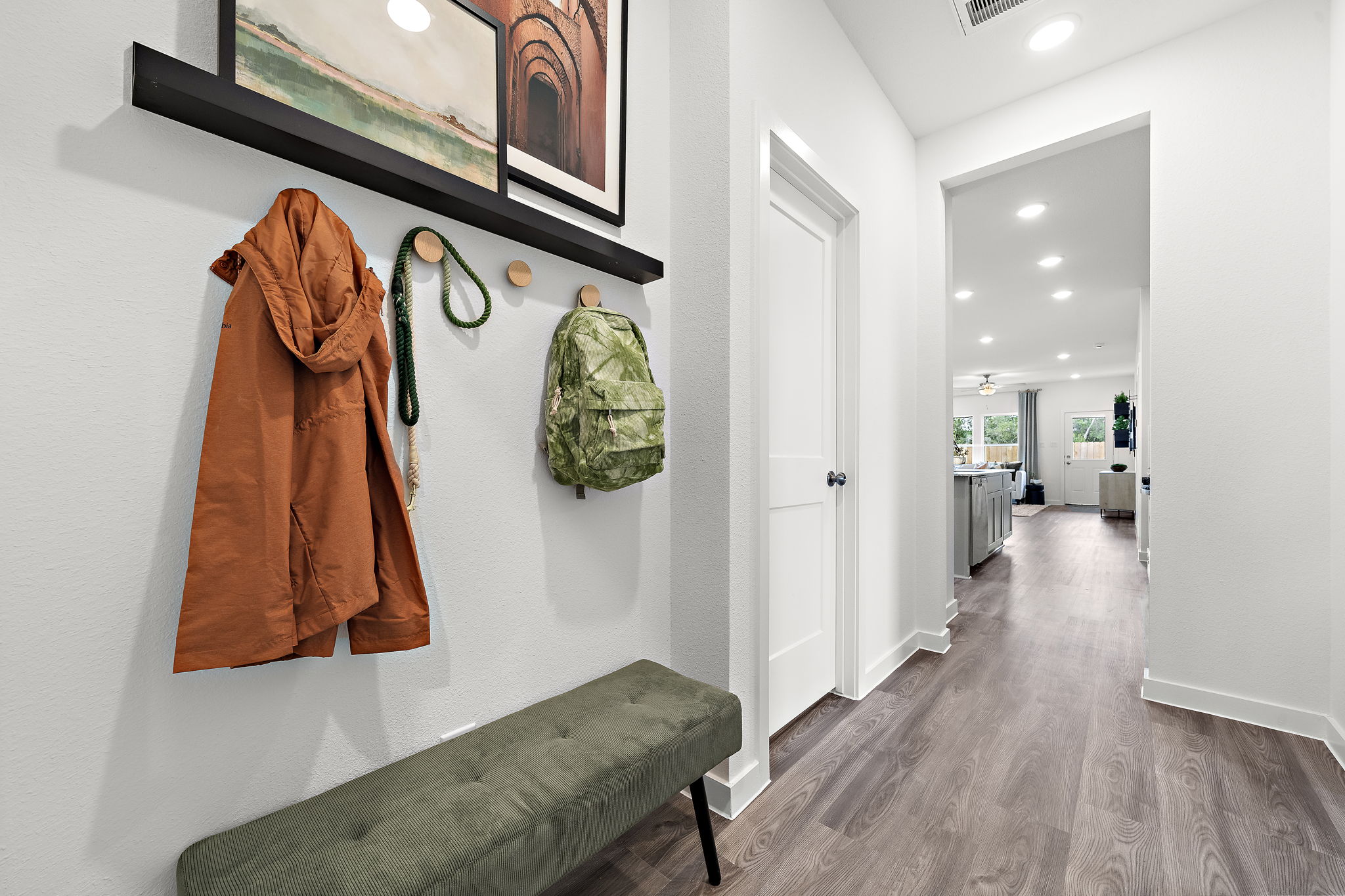 A room with a couch and a chair.