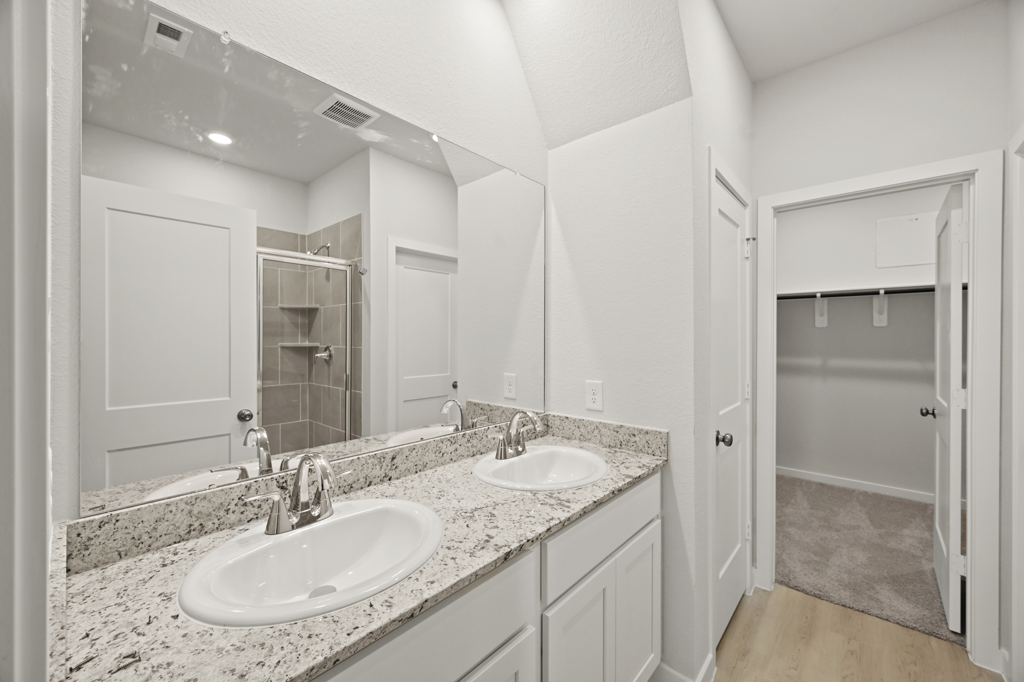 A bathroom with two sinks.