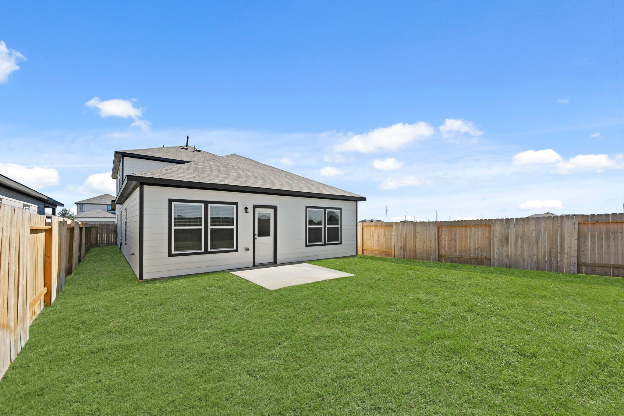 A small house in a yard.