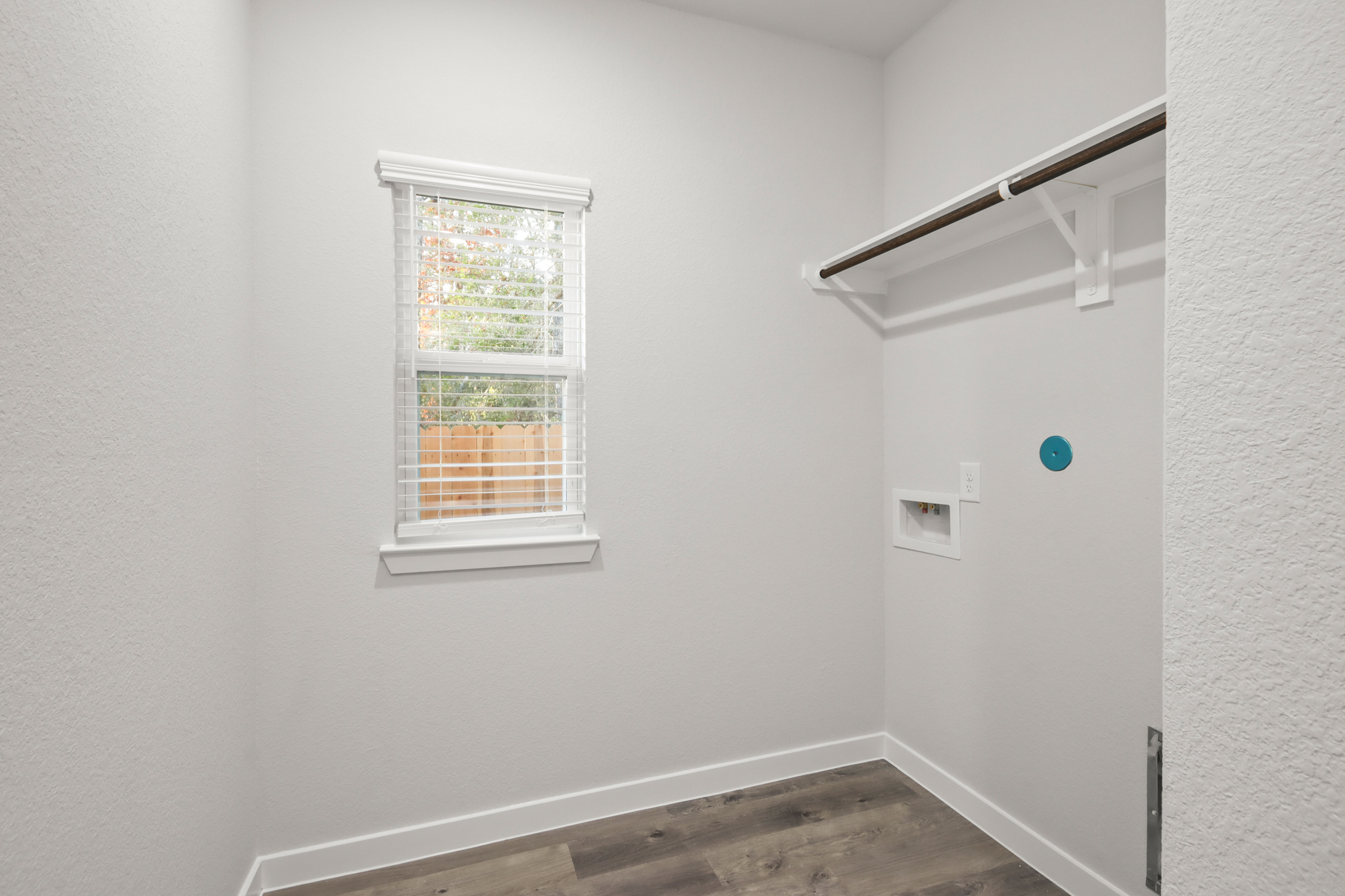 A room with a window and a door.