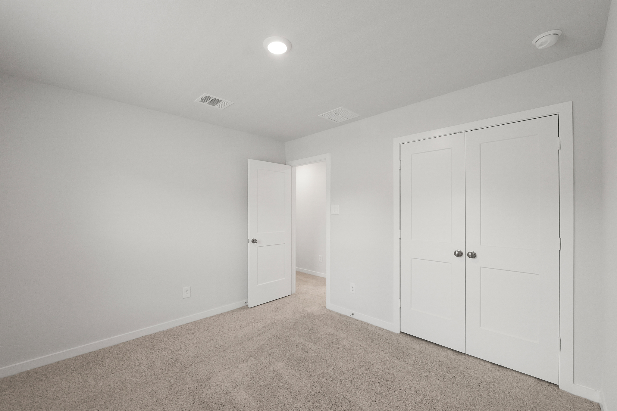 A room with white doors.