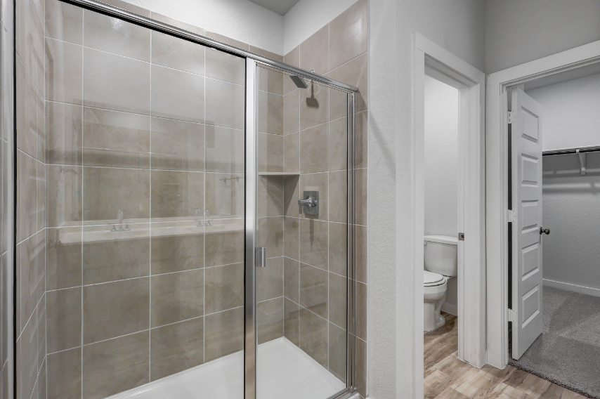 A bathroom with a glass shower.