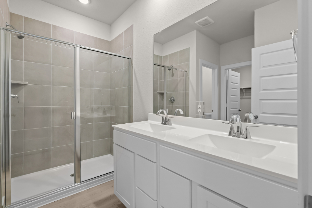 A bathroom with a glass shower.