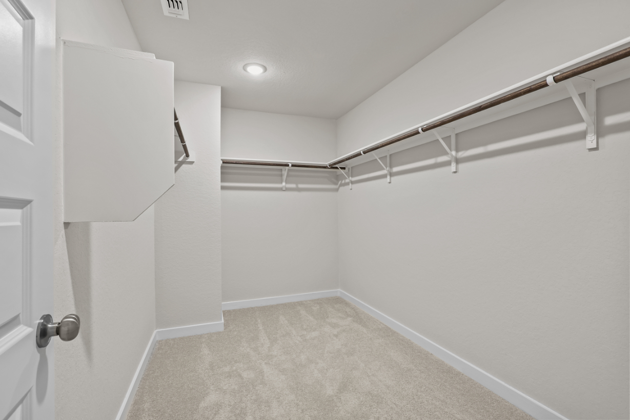 A hallway with white walls.