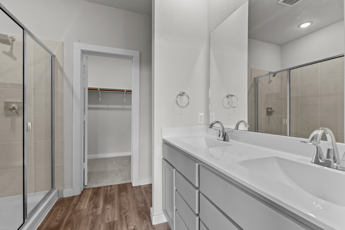 A bathroom with a glass shower.