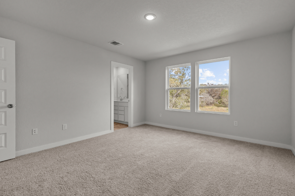 A room with a window and a door.