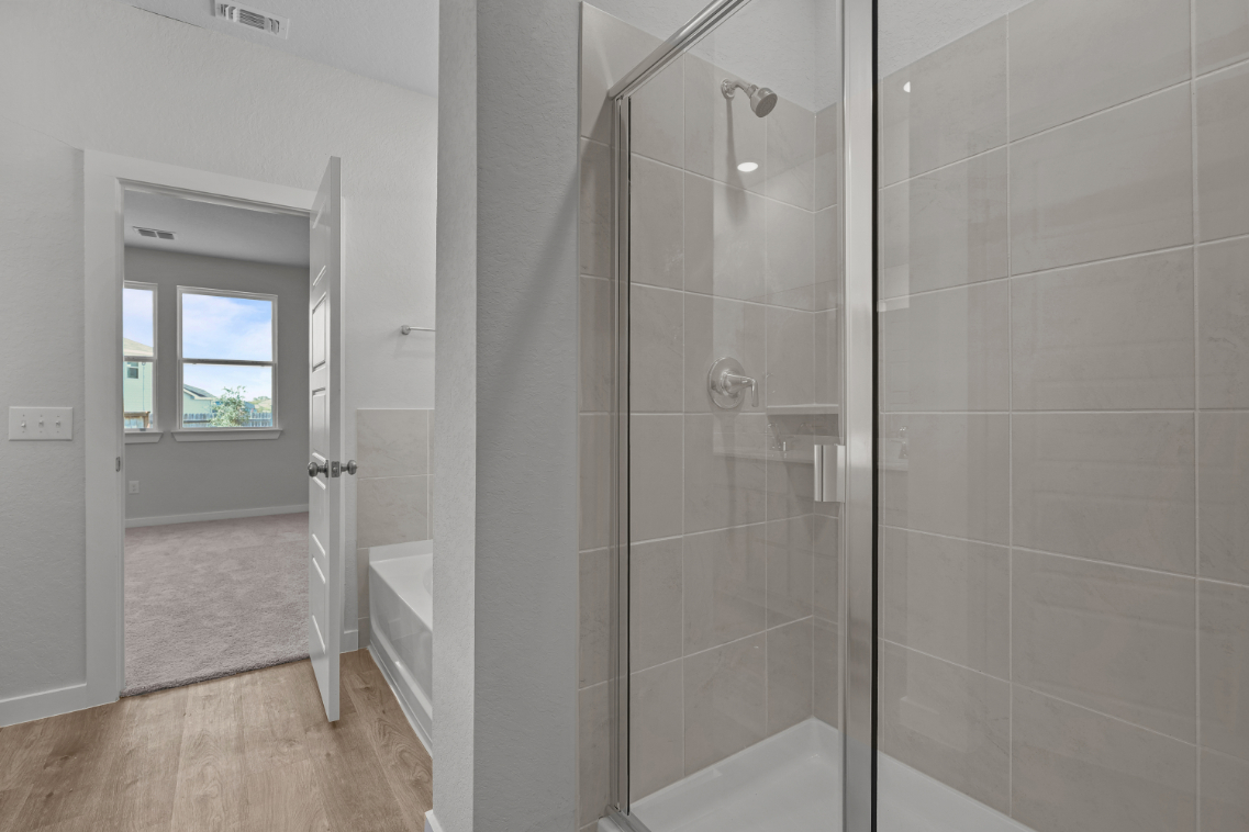 A bathroom with a glass shower.