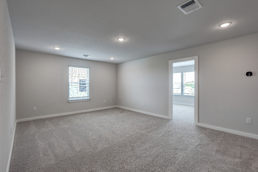 A room with a door and windows.